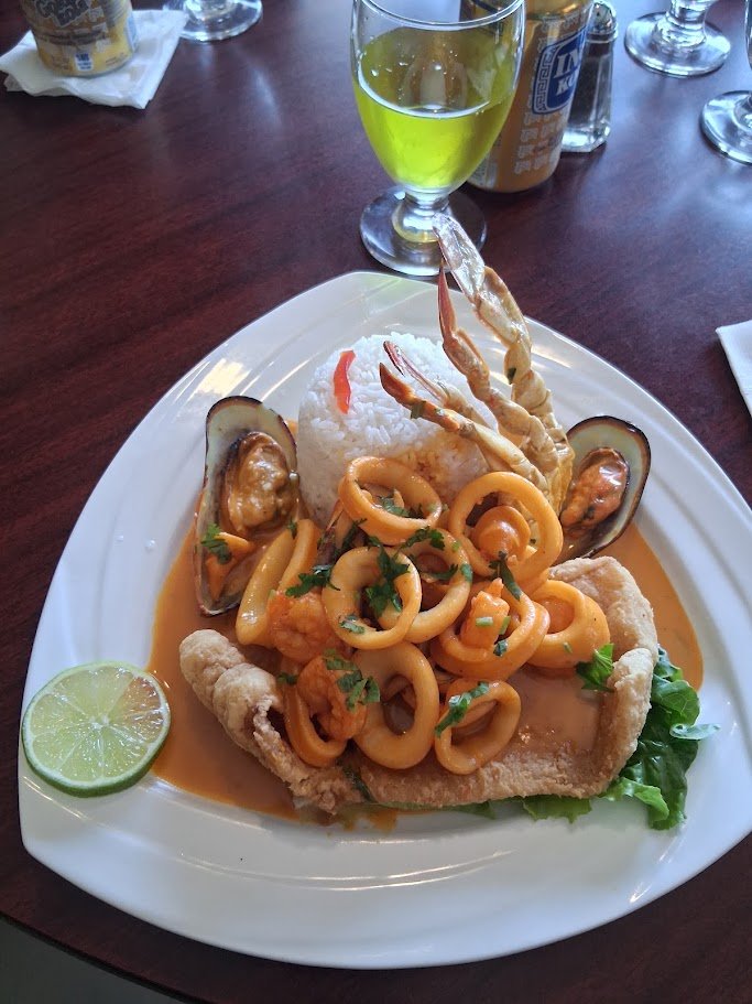Peruvian dishes arranged on white plates.
